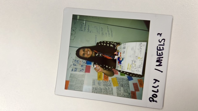 Me with our working board, paper prototype and Lego props.